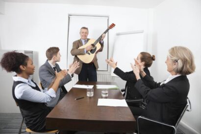 businessman-playing-guitar-in-business-meeting