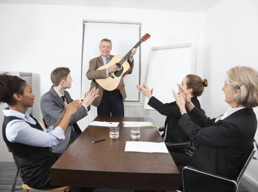 businessman-playing-guitar-in-business-meeting