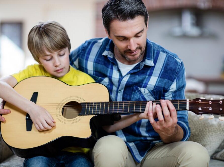 father-and-son-playing-a-guitar